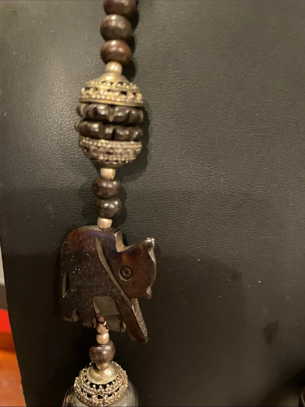 Handcrafted Elephant Pendant Necklace - Brown. Small elephants are bone.